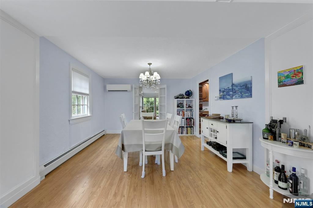 1280 Sussex Road Teaneck, NJ 07666 - Photo 6 of 36 a view of a dining room with furniture and wooden floor