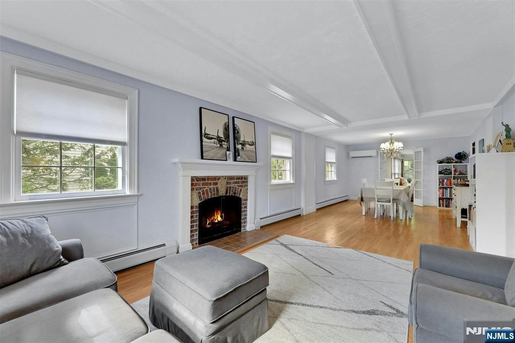 1280 Sussex Road Teaneck, NJ 07666 - Photo 7 of 36 a living room with furniture and a fireplace