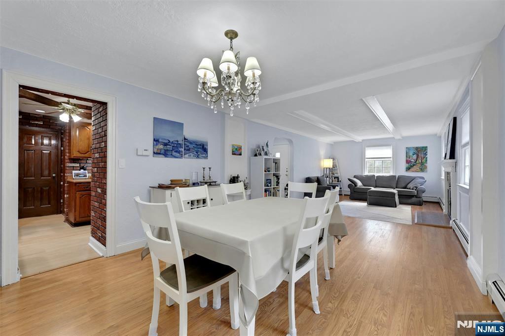 1280 Sussex Road Teaneck, NJ 07666 - Photo 8 of 36 a view of a dining room with furniture and wooden floor