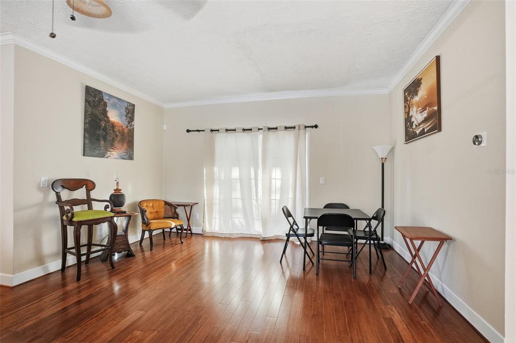 11805 Osprey Avenue Weeki Wachee, FL 34614 - Photo 11 of 34 a workspace with furniture window and wooden floor