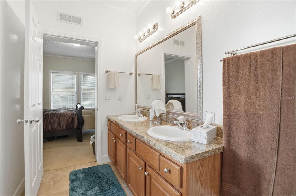 11805 Osprey Avenue Weeki Wachee, FL 34614 - Photo 14 of 34 a bathroom with a sink and a mirror