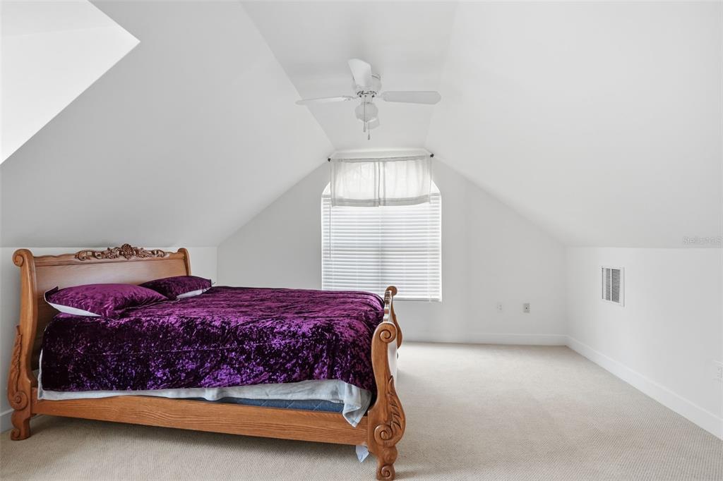 11805 Osprey Avenue Weeki Wachee, FL 34614 - Photo 22 of 34 a bedroom with a bed and window