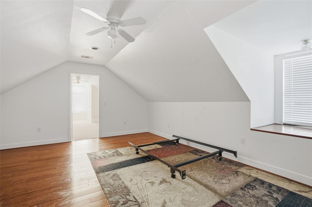 11805 Osprey Avenue Weeki Wachee, FL 34614 - Photo 24 of 34 wooden floor in a hall with an entryway and a workspace