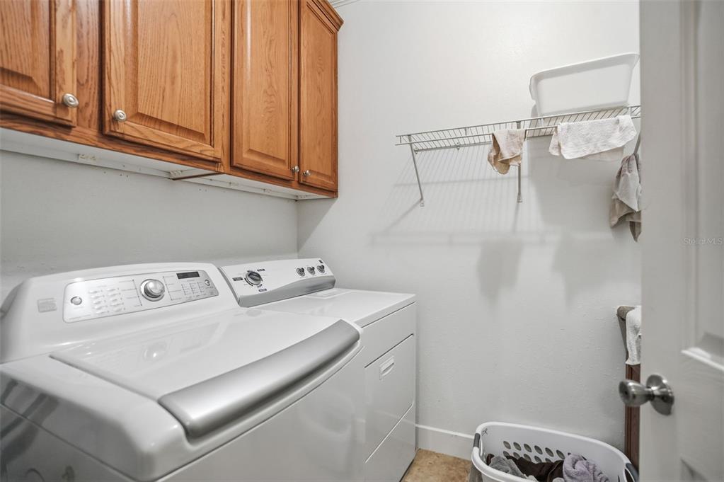 11805 Osprey Avenue Weeki Wachee, FL 34614 - Photo 30 of 34 a utility room with dryer and washer