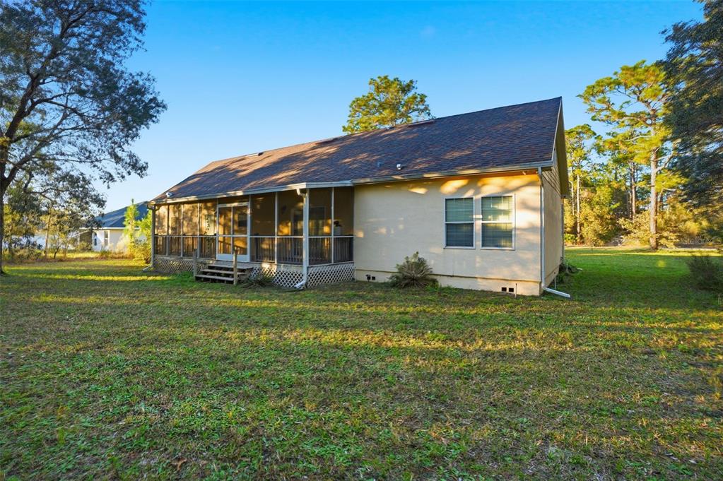 11805 Osprey Avenue Weeki Wachee, FL 34614 - Photo 34 of 34 a view of a house with a yard