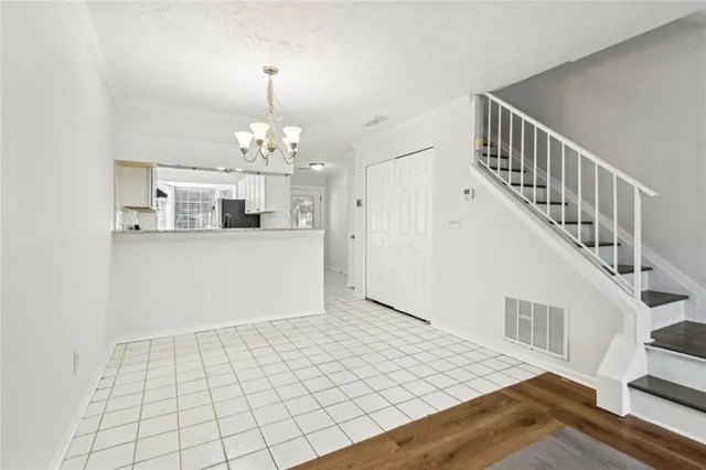 a view of a kitchen with a sink and cabinets