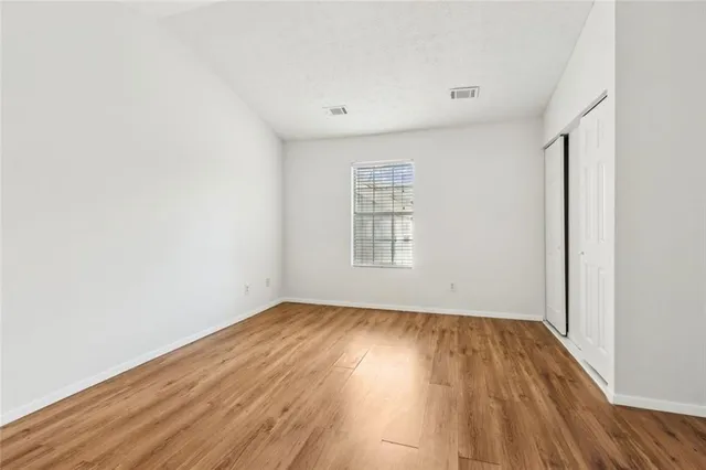 a view of a livingroom with wooden floor