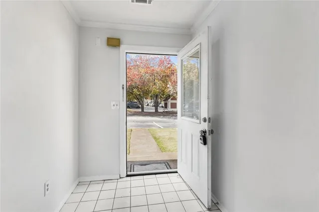 a view of an empty room with a fireplace