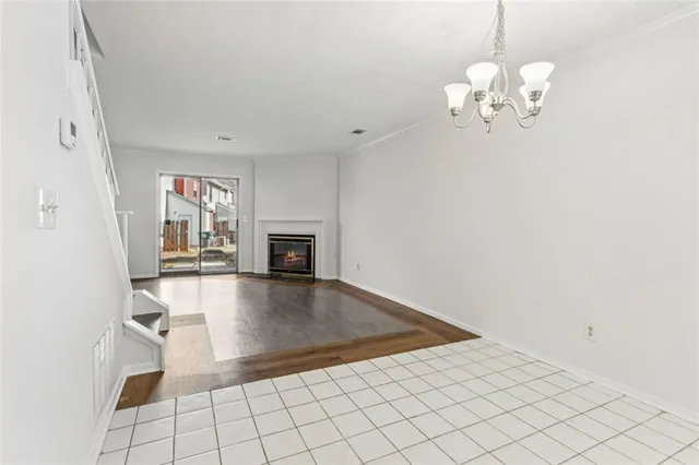 a view of empty room with fireplace