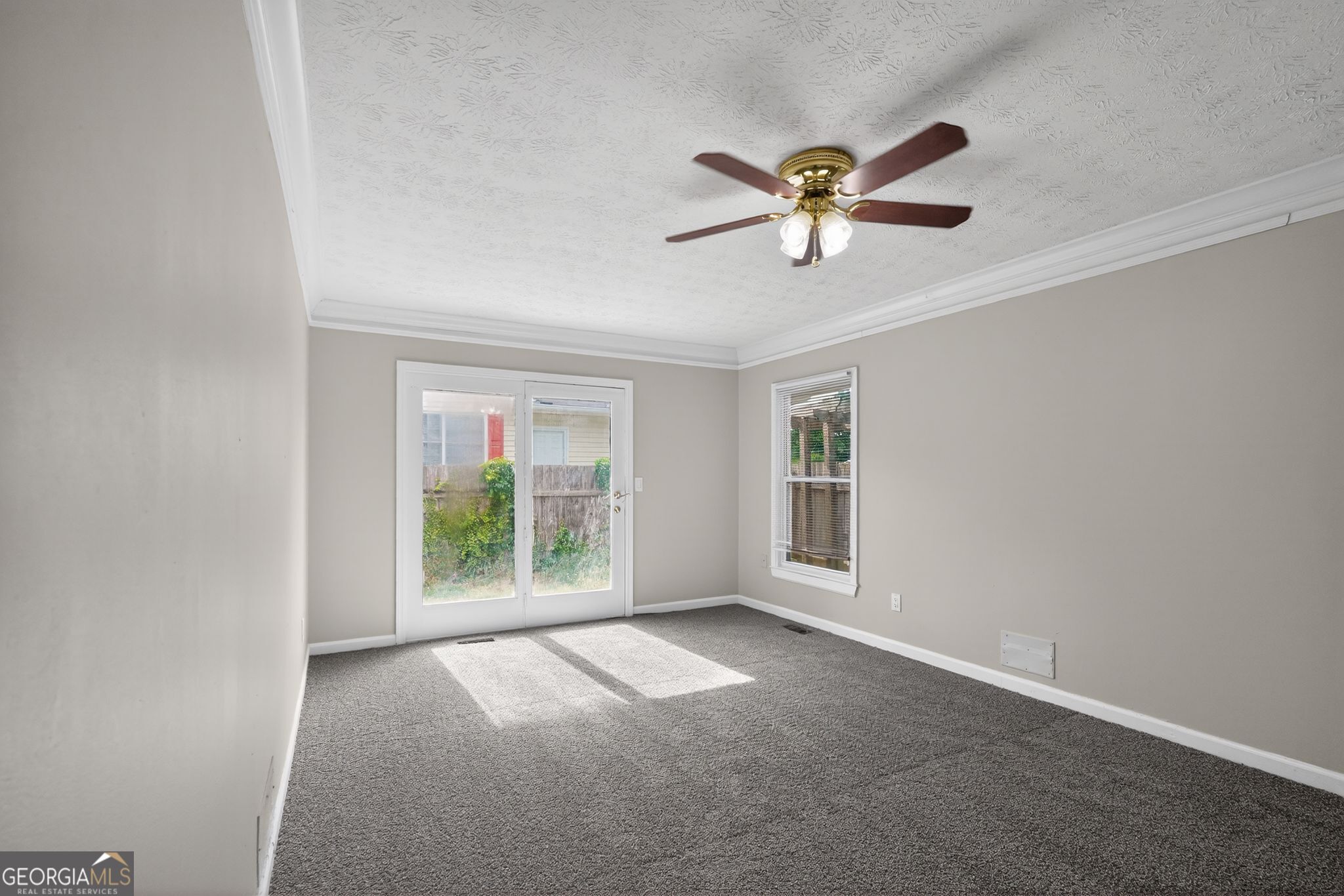 3285 Old Salem Road Southeast Conyers, GA 30013 - Photo 13 of 33 a view of a livingroom with a ceiling fan and window