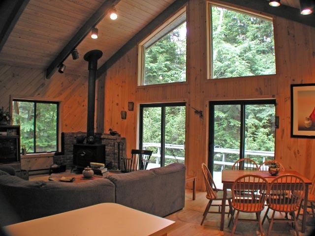 34 Sitting Bull Road Becket, MA 01223 - Photo 3 of 9 a living room with furniture and a large window