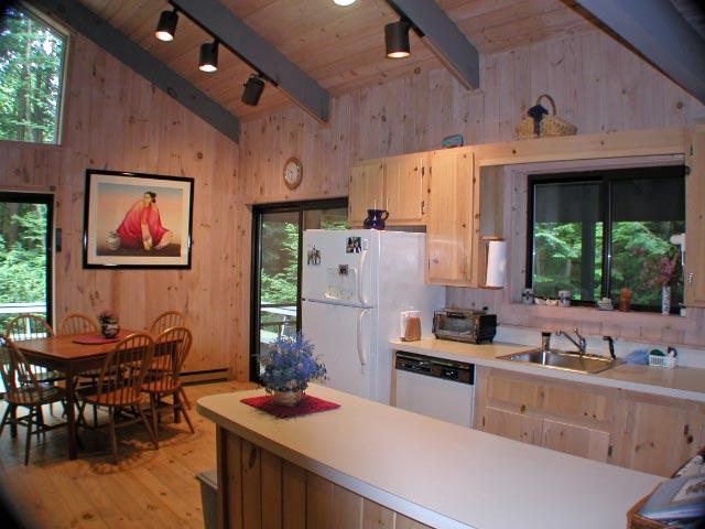 34 Sitting Bull Road Becket, MA 01223 - Photo 4 of 9 a kitchen with stainless steel appliances granite countertop a sink stove and a refrigerator
