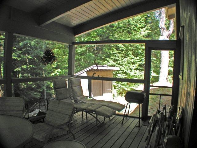 34 Sitting Bull Road Becket, MA 01223 - Photo 5 of 9 a view of a porch with furniture and wooden floor