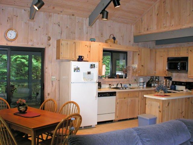 34 Sitting Bull Road Becket, MA 01223 - Photo 6 of 9 a kitchen that has a table and chairs in it