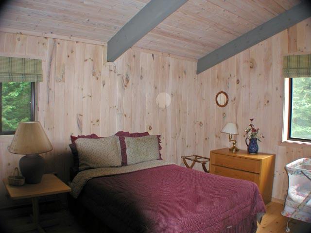 34 Sitting Bull Road Becket, MA 01223 - Photo 8 of 9 a bedroom with furniture and a large window