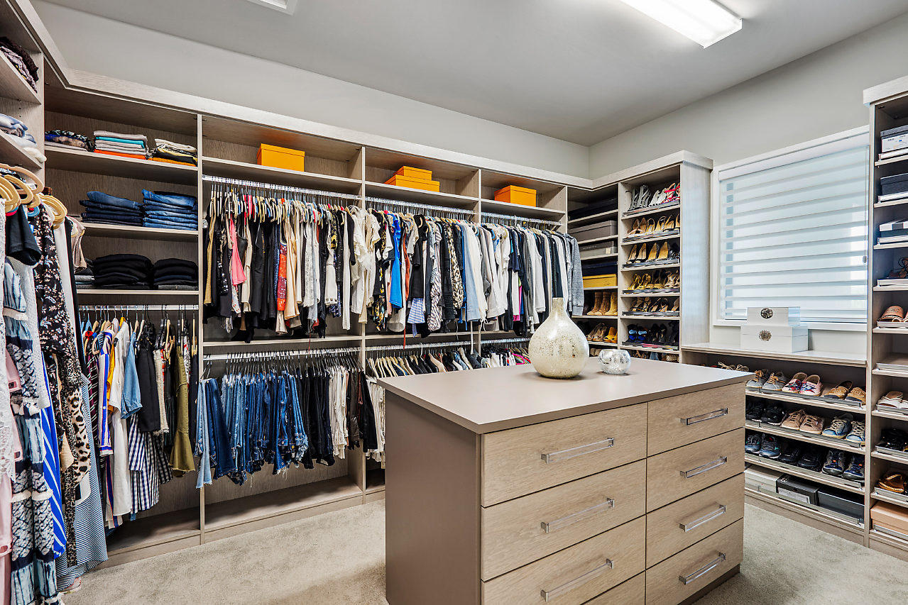 17566 Grand Este Way Boca Raton, FL 33496 - Photo 25 of 116 a view of walk in closet with clothes and shoes