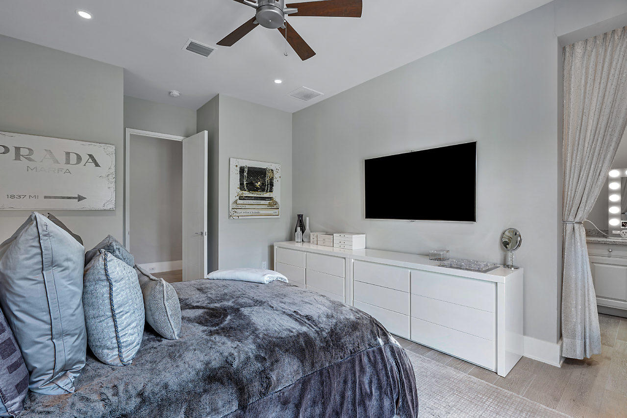 17566 Grand Este Way Boca Raton, FL 33496 - Photo 35 of 116 a bedroom with a bed and a flat screen tv