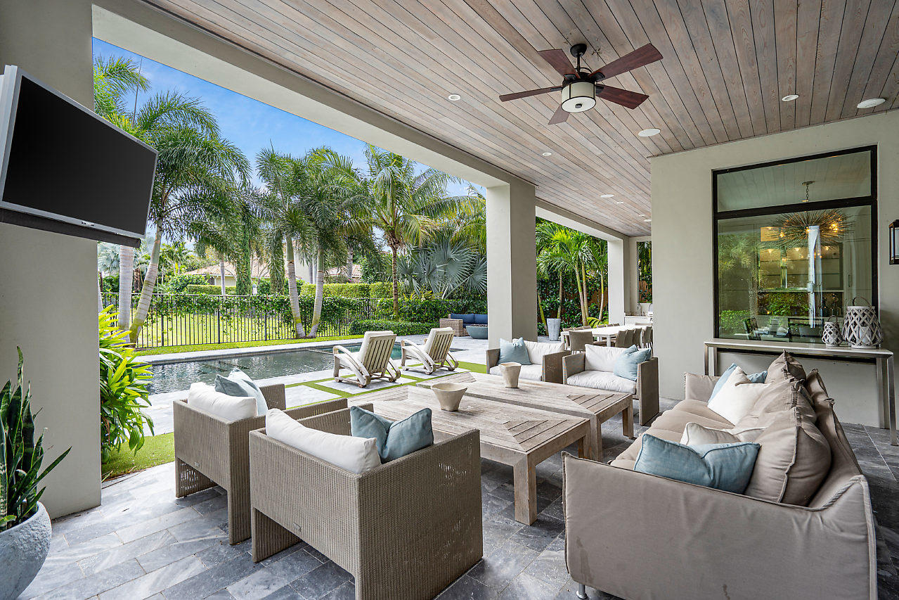 17566 Grand Este Way Boca Raton, FL 33496 - Photo 58 of 116 a living room with patio furniture and a floor to ceiling window