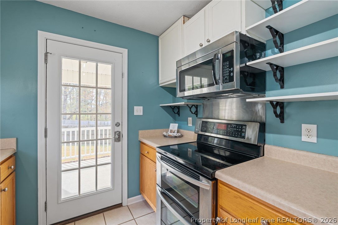 115 Shelby Street Spring Lake, NC 28390 - Photo 17 of 40 a kitchen that has a stove and a microwave