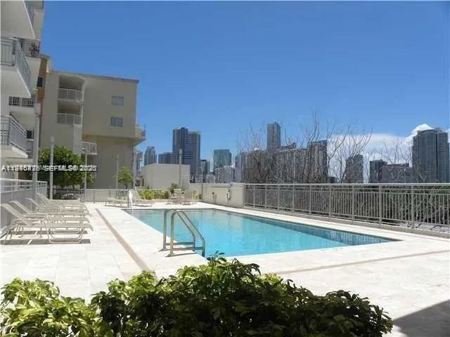 a view of a swimming pool with a patio