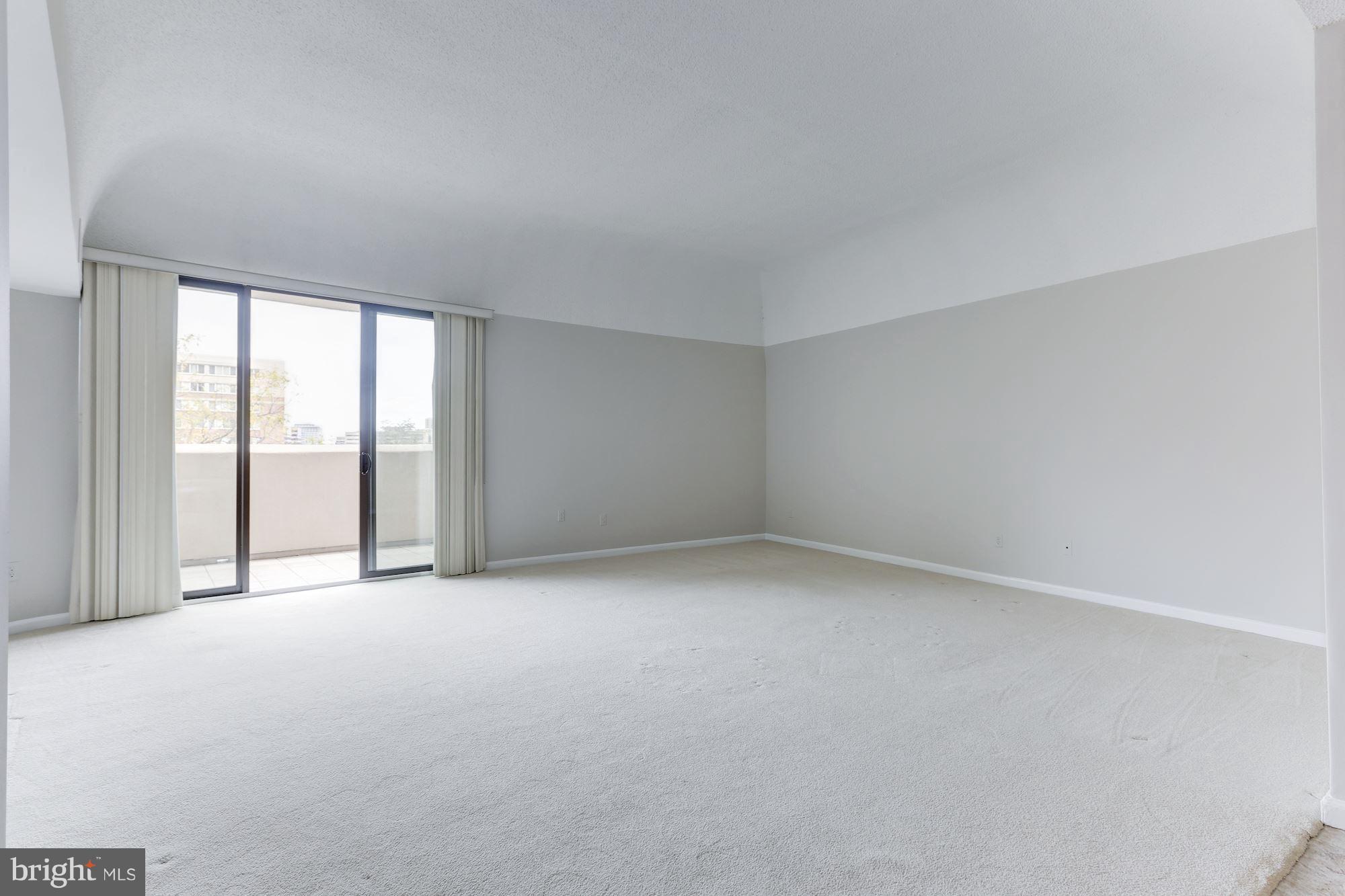 1101 South Arlington Ridge Road, Unit 113 Arlington, VA 22202 - Photo 7 of 30 a view of an empty room with a window