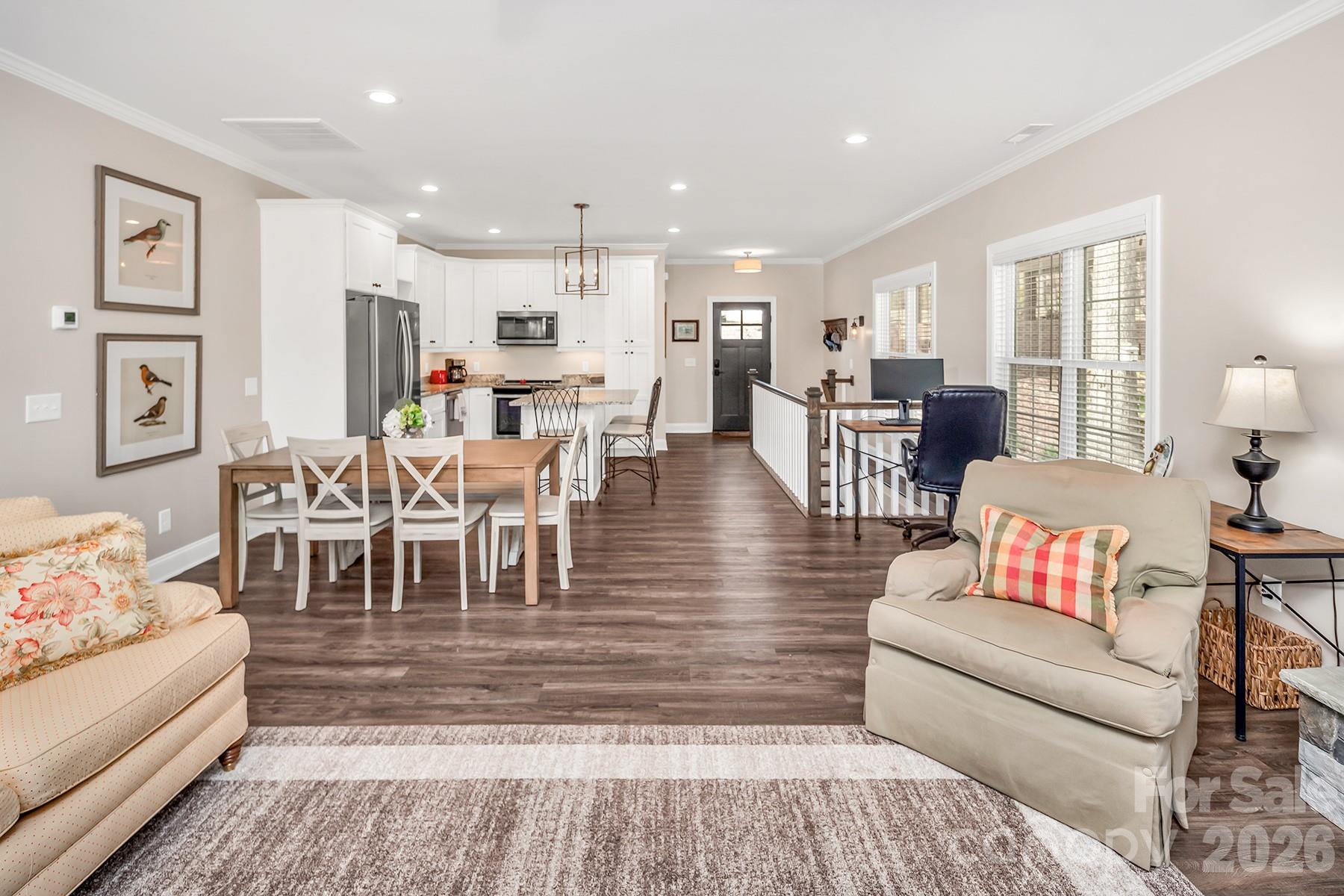 689 Emerald Shores Road Mount Gilead, NC 27306 - Photo 19 of 46 a living room with lots of furniture and view of kitchen