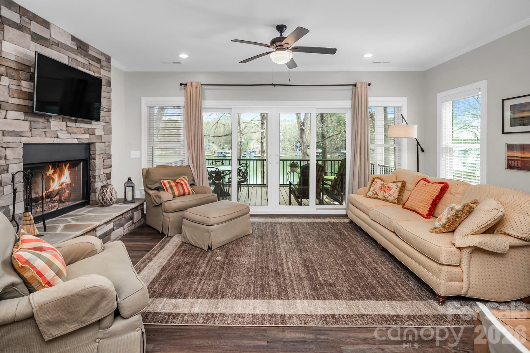 689 Emerald Shores Road Mount Gilead, NC 27306 - Photo 21 of 46 a living room with furniture fireplace and flat screen tv