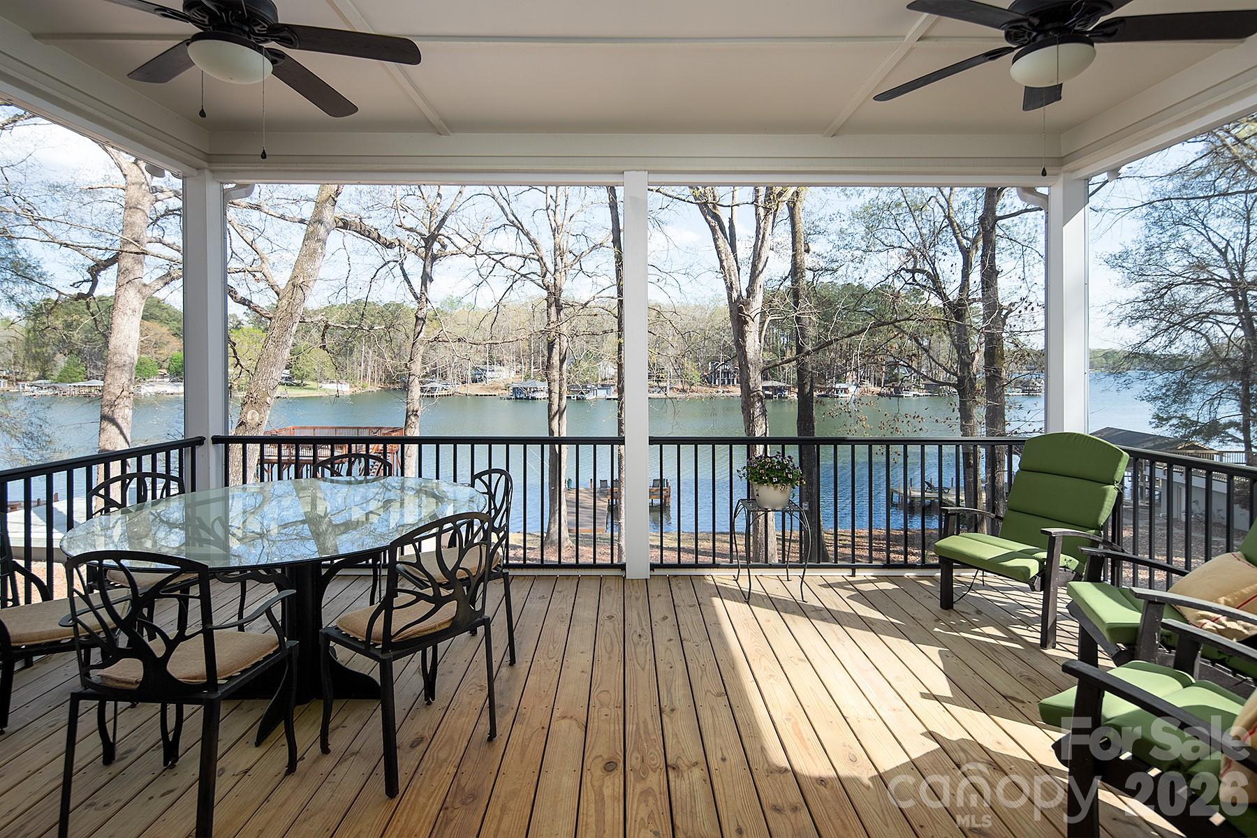 689 Emerald Shores Road Mount Gilead, NC 27306 - Photo 22 of 46 a view of balcony with furniture and wooden floor