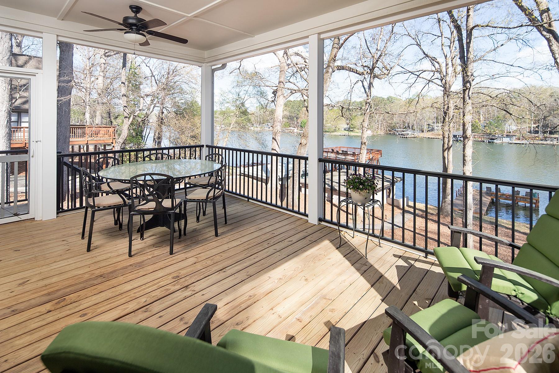 689 Emerald Shores Road Mount Gilead, NC 27306 - Photo 23 of 46 a view of a dining room with furniture window and wooden floor