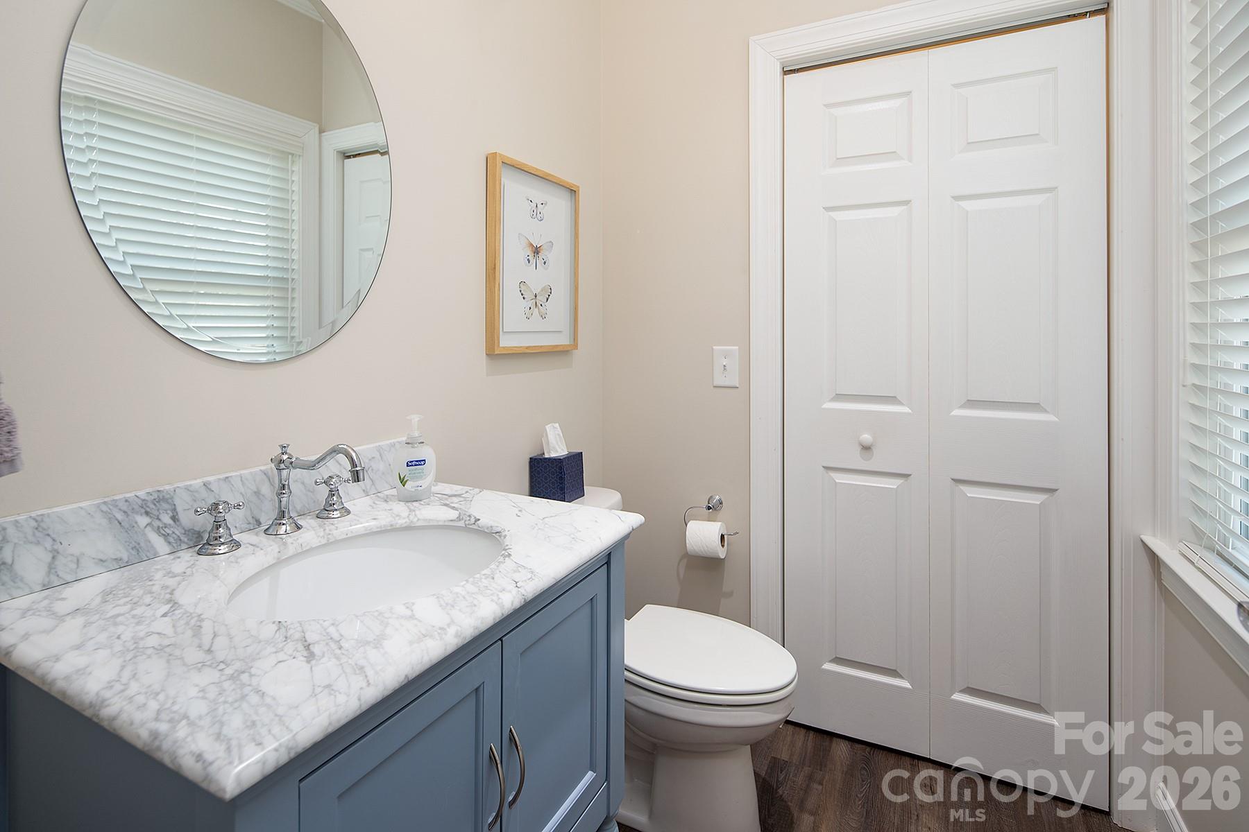 689 Emerald Shores Road Mount Gilead, NC 27306 - Photo 26 of 46 a bathroom with a granite countertop sink and a mirror