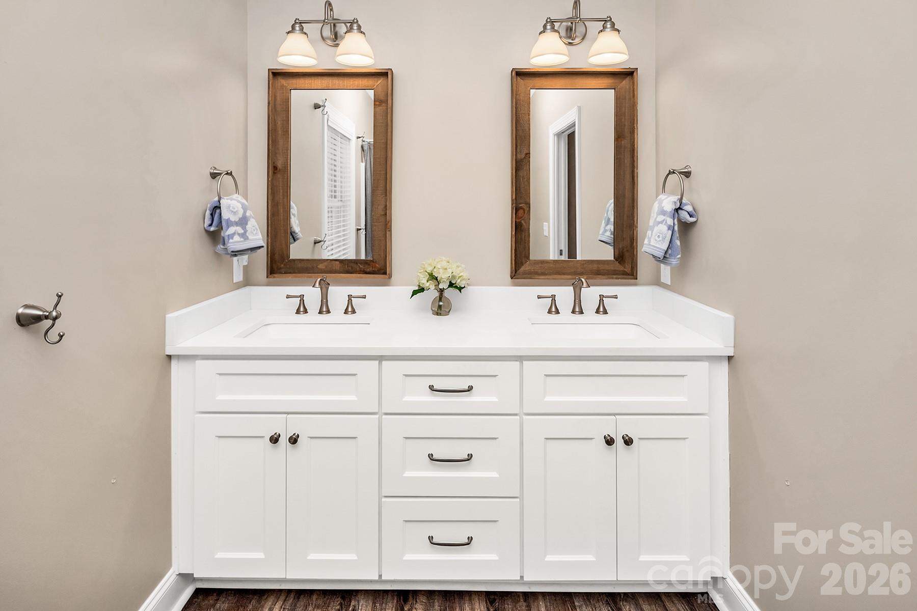 689 Emerald Shores Road Mount Gilead, NC 27306 - Photo 28 of 46 a bathroom with a sink vanity and a mirror