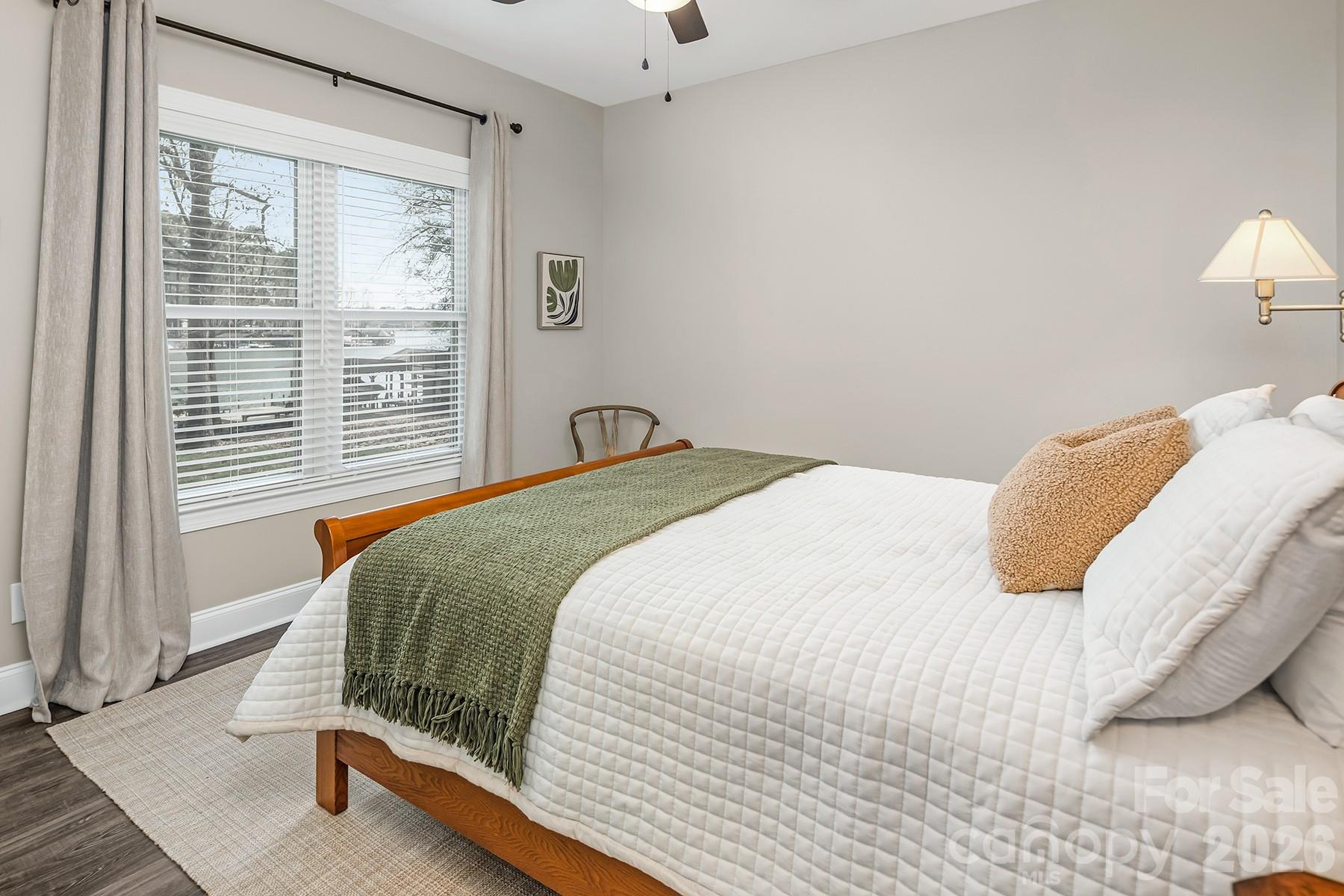 689 Emerald Shores Road Mount Gilead, NC 27306 - Photo 34 of 46 a bedroom with a bed and a window