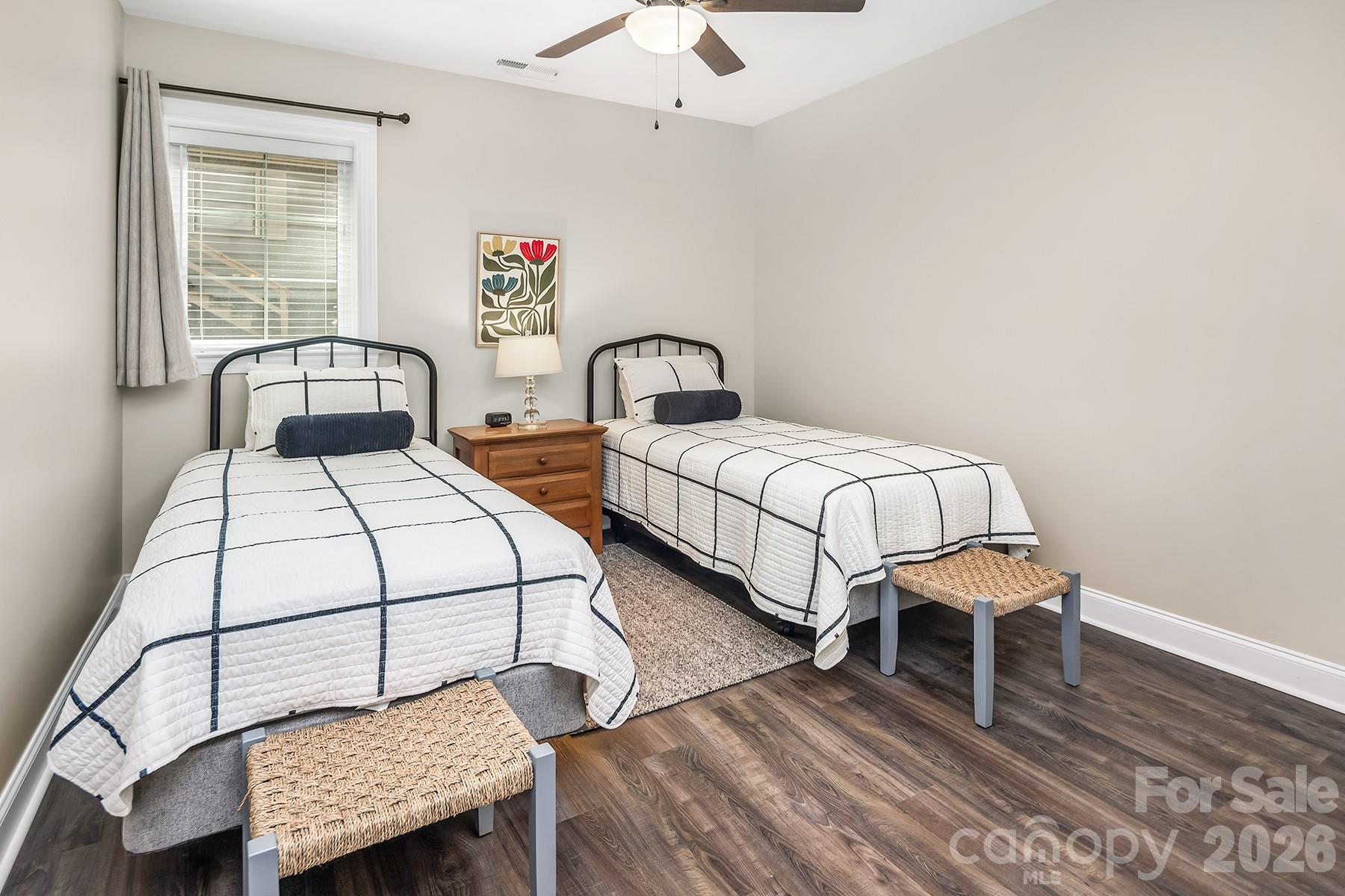 689 Emerald Shores Road Mount Gilead, NC 27306 - Photo 36 of 46 a bedroom with two beds and a window