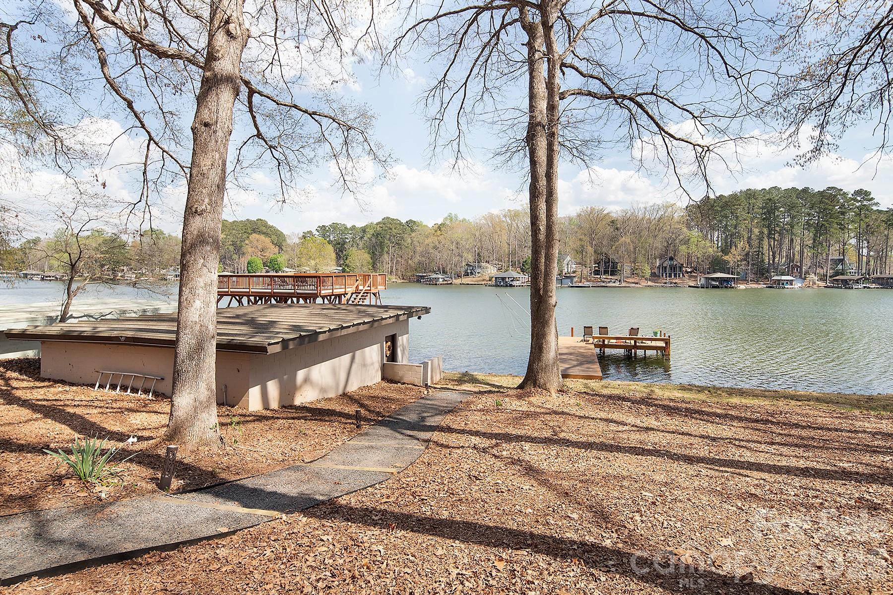 689 Emerald Shores Road Mount Gilead, NC 27306 - Photo 38 of 46 a view of a lake with a large trees