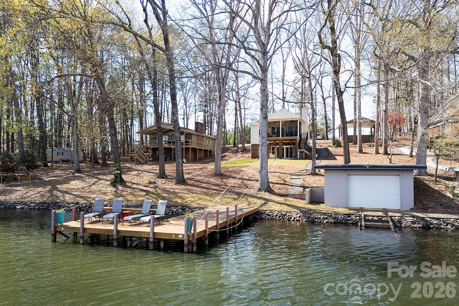 689 Emerald Shores Road Mount Gilead, NC 27306 - Photo 41 of 46 a view of house with swimming pool and sitting area