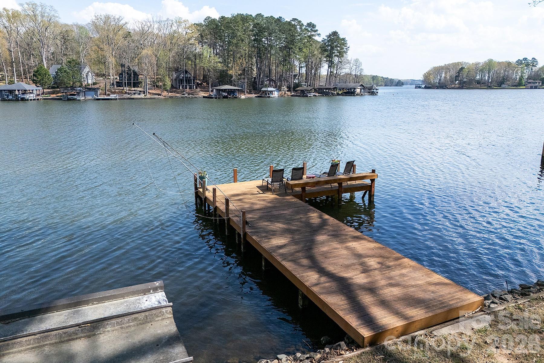 689 Emerald Shores Road Mount Gilead, NC 27306 - Photo 42 of 46 a view of a lake with houses