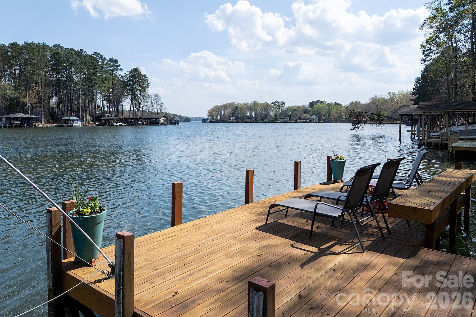 689 Emerald Shores Road Mount Gilead, NC 27306 - Photo 43 of 46 a view of a lake with outdoor seating