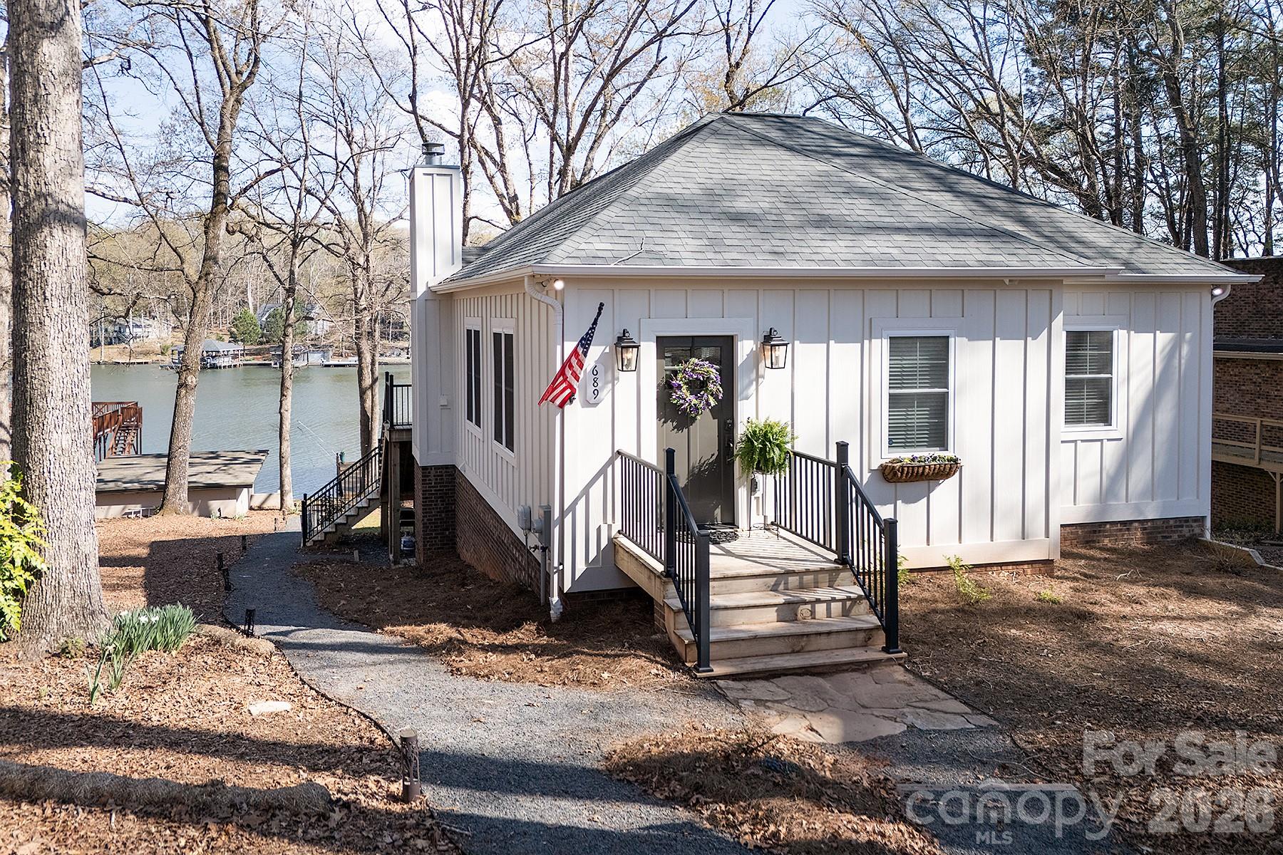 689 Emerald Shores Road Mount Gilead, NC 27306 - Photo 46 of 46 a view of a house with a sink and wooden fence
