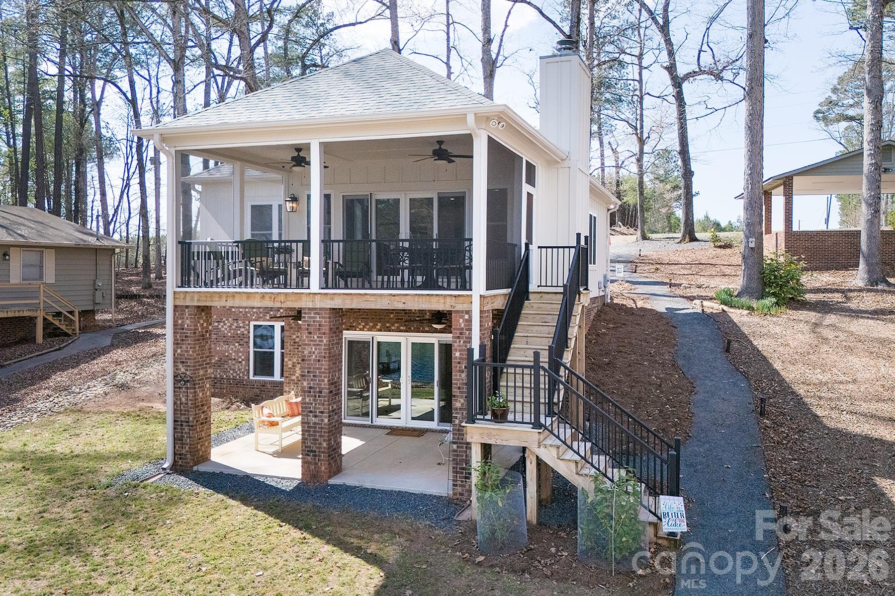 689 Emerald Shores Road Mount Gilead, NC 27306 - Photo 5 of 46 a view of a house with backyard and sitting area