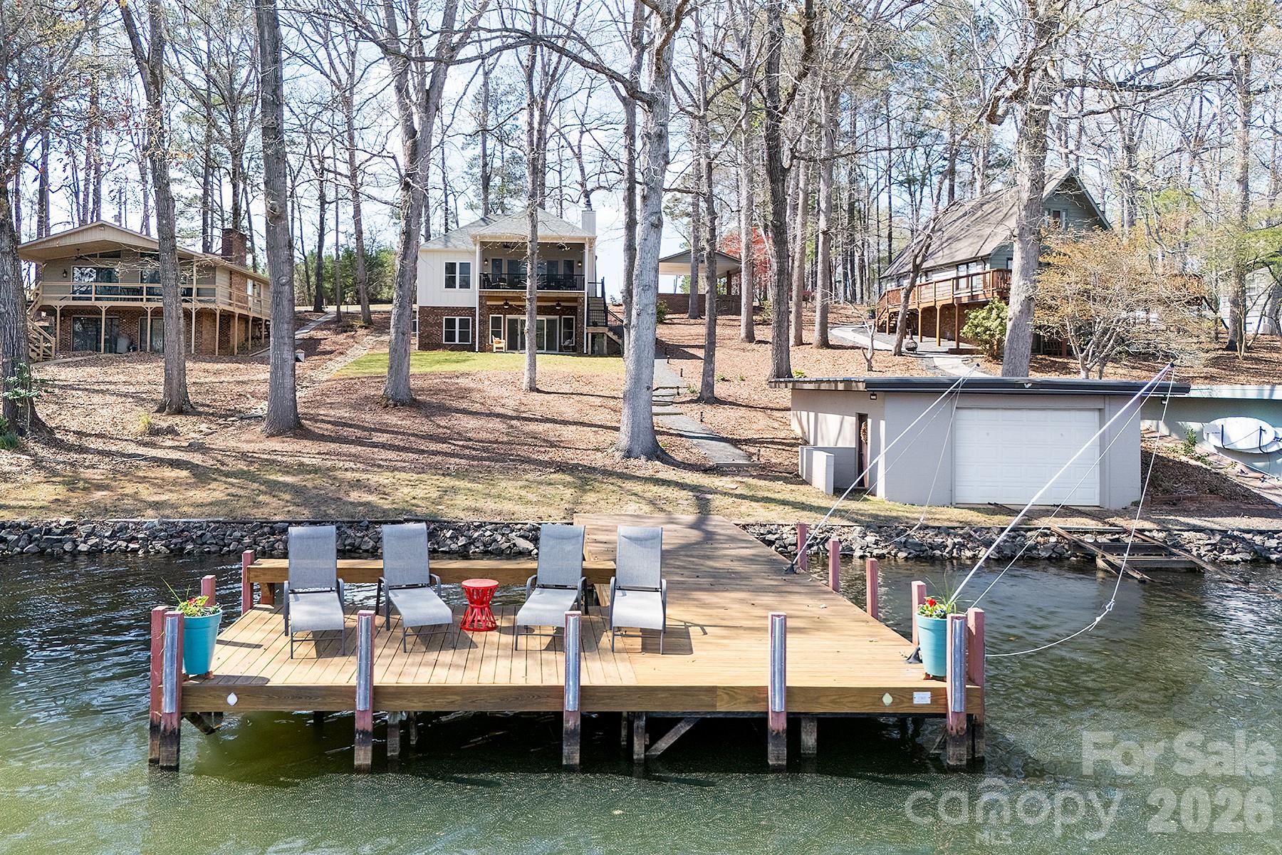 689 Emerald Shores Road Mount Gilead, NC 27306 - Photo 6 of 46 a view of backyard with seating area and trees