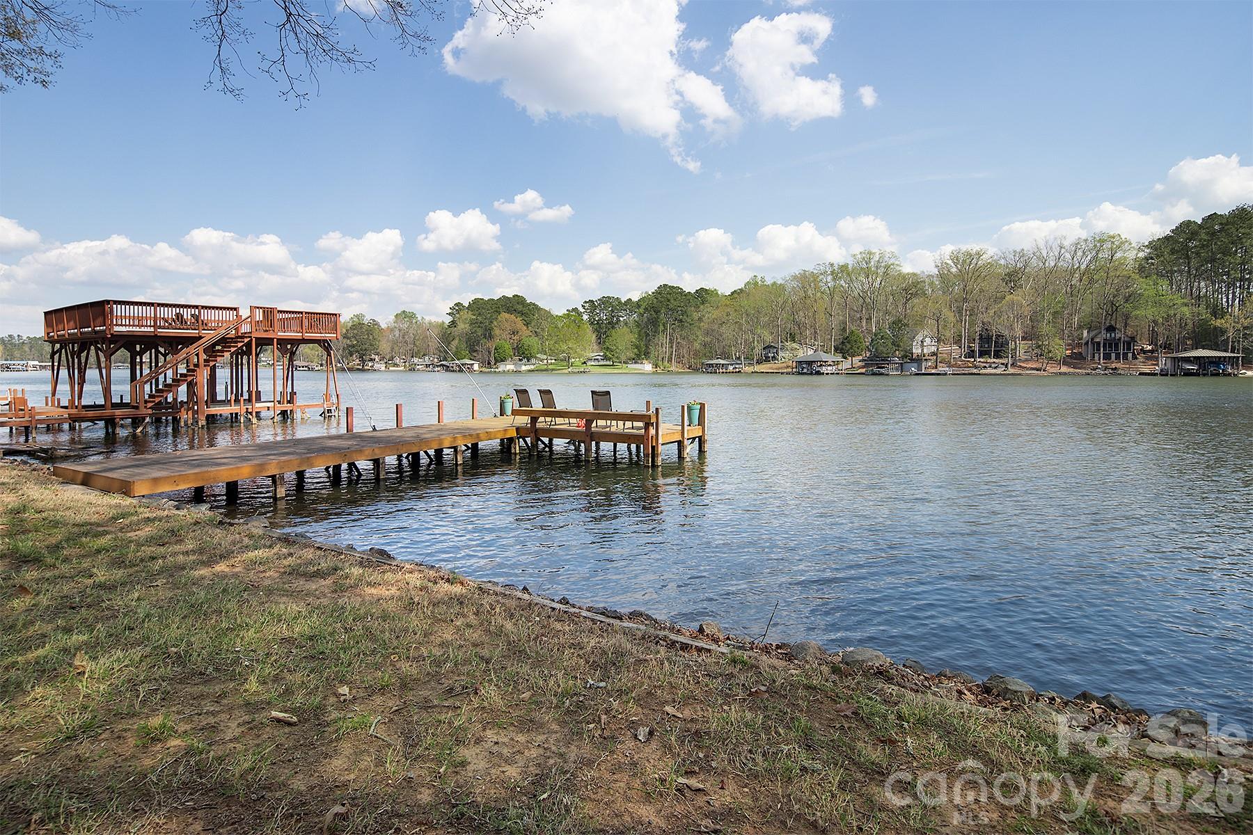 689 Emerald Shores Road Mount Gilead, NC 27306 - Photo 7 of 46 a view of a lake with houses