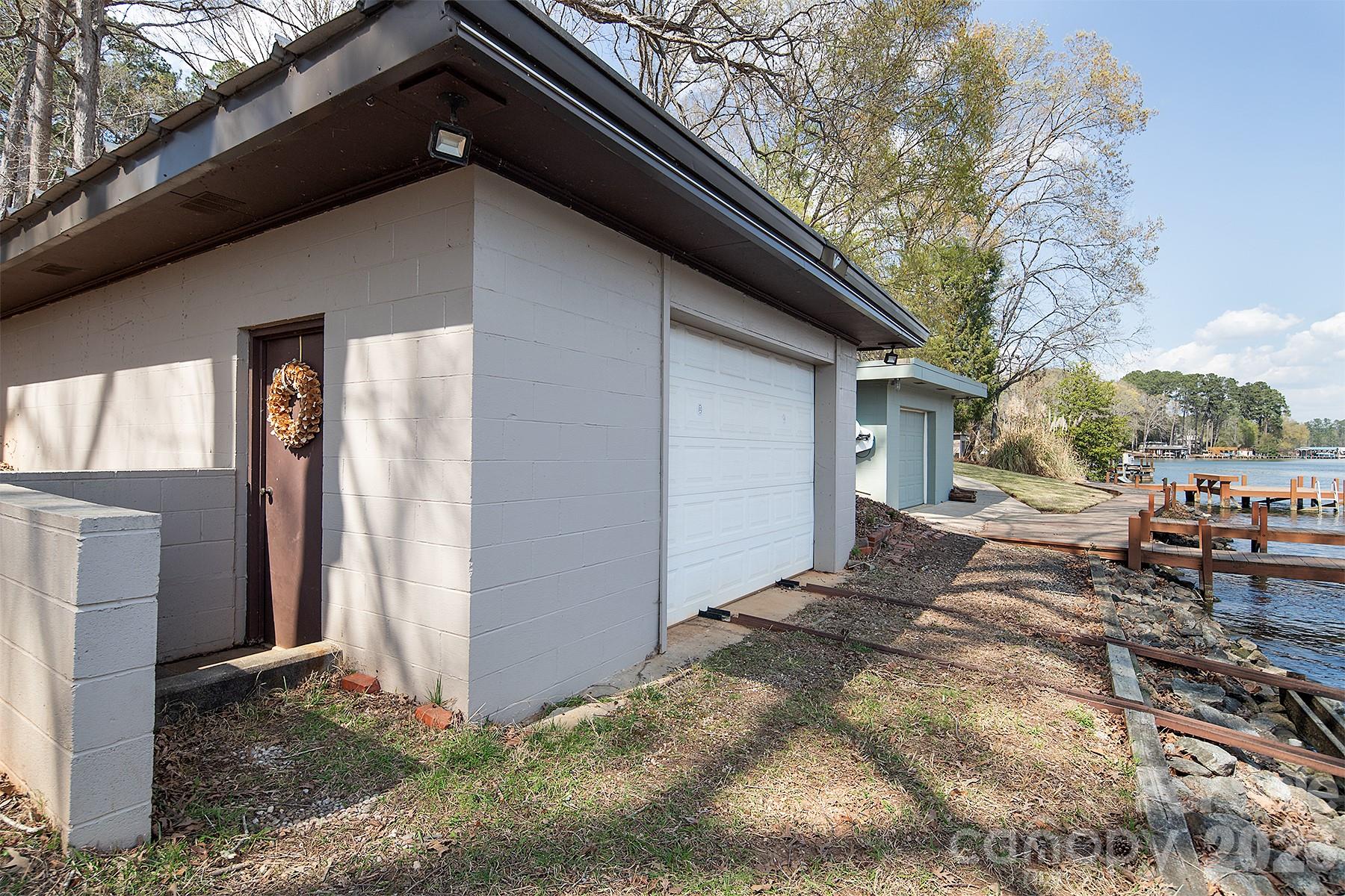 689 Emerald Shores Road Mount Gilead, NC 27306 - Photo 9 of 46 a backyard of a house with yard and outdoor seating