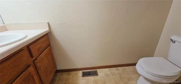 a bathroom with a toilet and a sink
