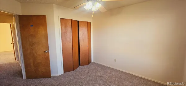 a view of a bathroom with a shower and a mirror