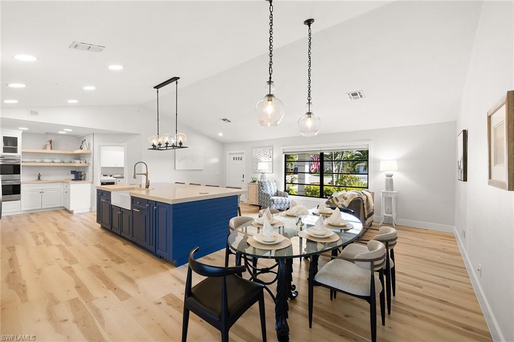 130 Torrey Pines Point Naples, FL 34113 - Photo 15 of 44 a kitchen with a table and chairs in it