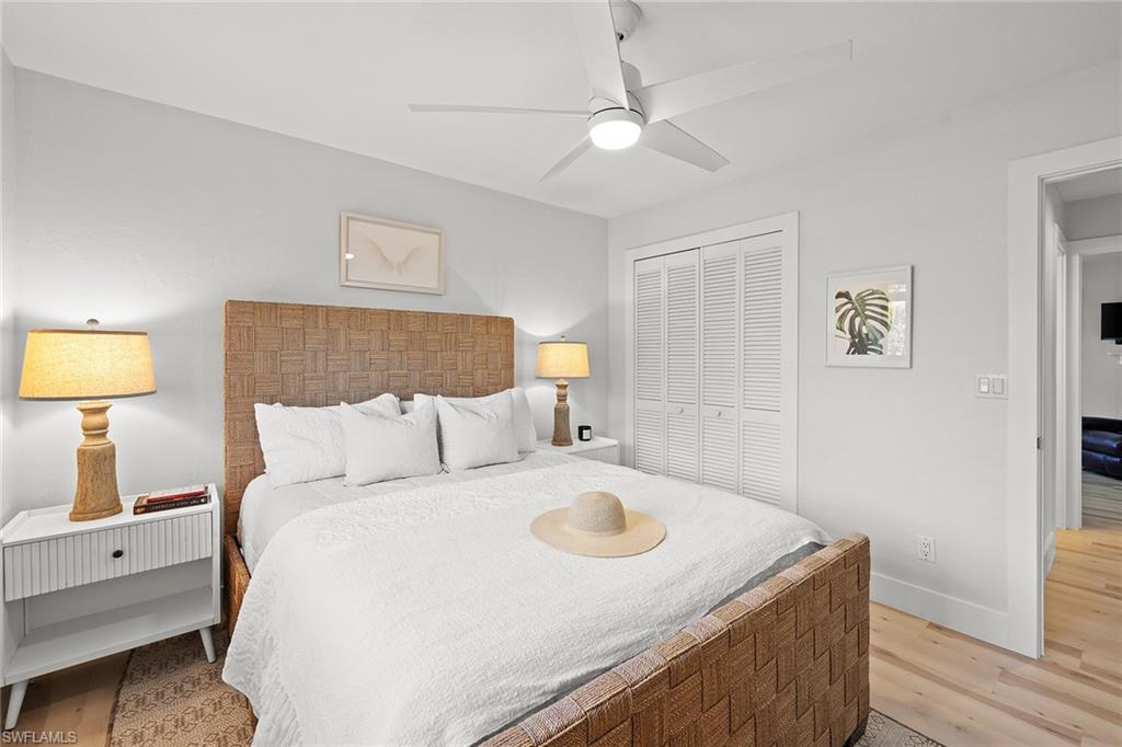 130 Torrey Pines Point Naples, FL 34113 - Photo 27 of 44 a bed room with a bed and a lamp
