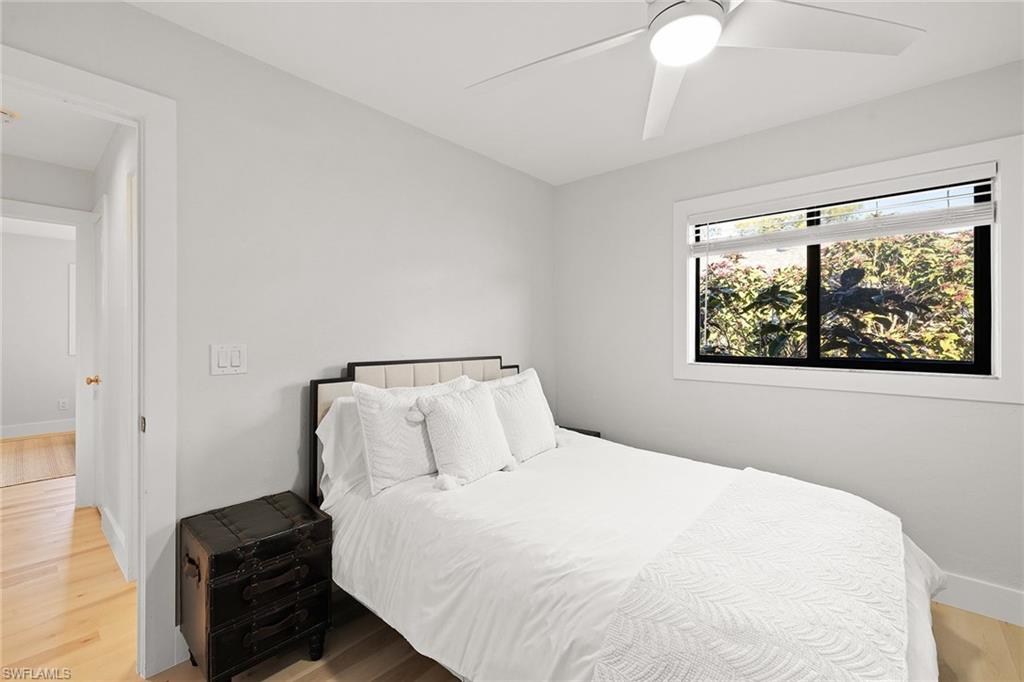 130 Torrey Pines Point Naples, FL 34113 - Photo 29 of 44 a bedroom with a bed and a window