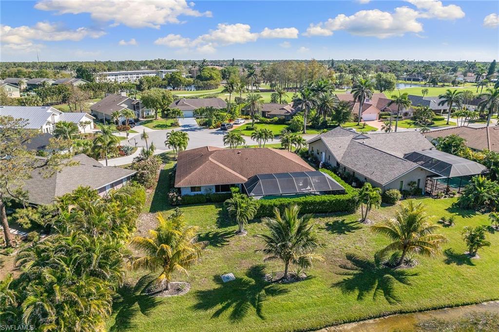 130 Torrey Pines Point Naples, FL 34113 - Photo 4 of 44 a view of a garden with a houses