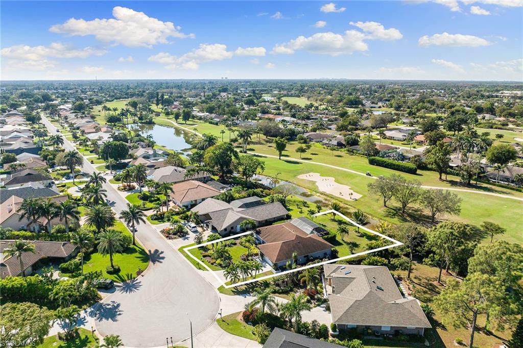 130 Torrey Pines Point Naples, FL 34113 - Photo 42 of 44 an aerial view of residential houses with outdoor space