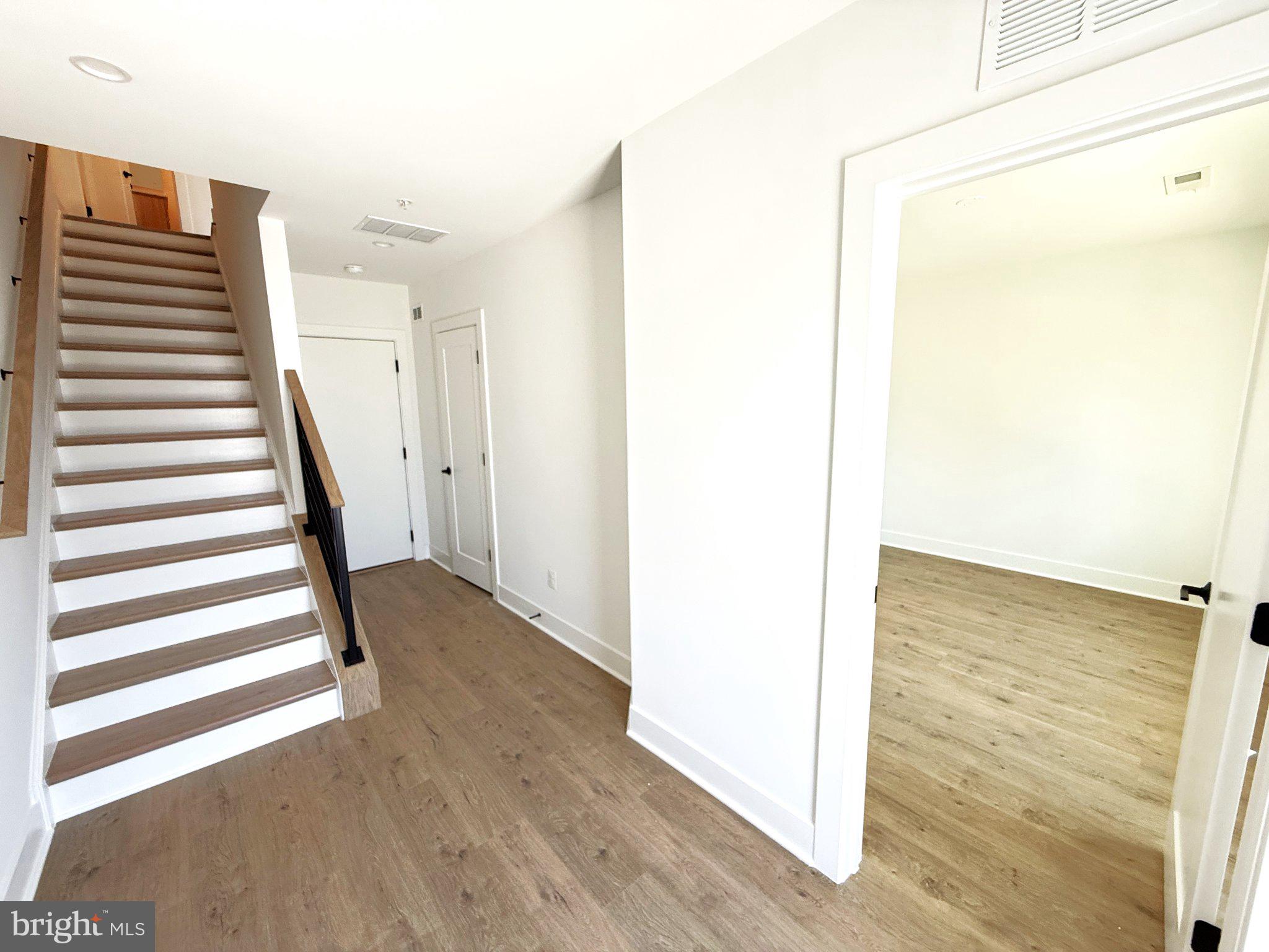 33 Lower Service Court Northwest Washington, DC 20001 - Photo 7 of 51 Bright entryway with modern staircase.